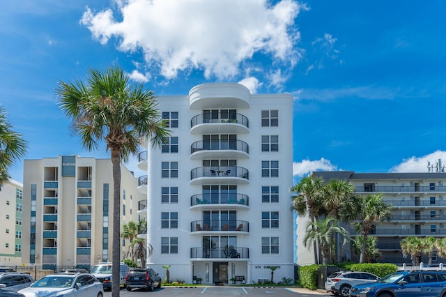 view of property with uncovered parking