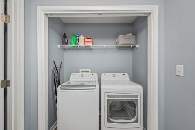 laundry room featuring washing machine and dryer and laundry area