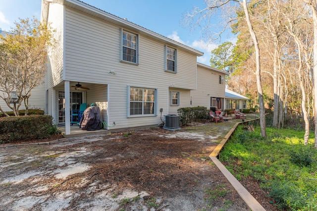 rear view of house featuring ceiling fan, a patio, and central AC unit