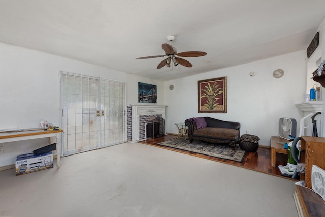 1005 Revere Dr, Pensacola, FL 32506 - living area with a fireplace, concrete floors, and a ceiling fan