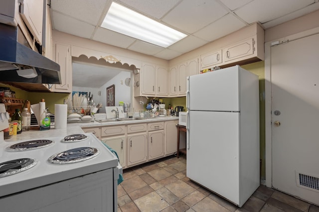 1005 Revere Dr, Pensacola, FL 32506 - kitchen with light countertops, a sink, under cabinet range hood, white appliances, and visible vents