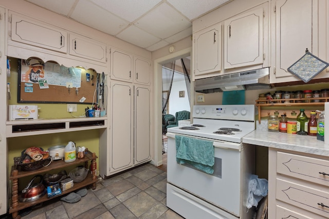 1005 Revere Dr, Pensacola, FL 32506 - kitchen featuring white cabinetry, light countertops, under cabinet range hood, electric range, and a drop ceiling