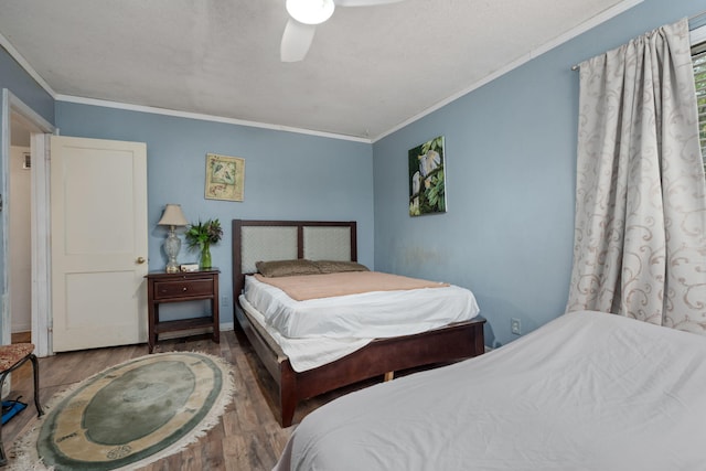 1005 Revere Dr, Pensacola, FL 32506 - bedroom with baseboards, ceiling fan, wood finished floors, and crown molding