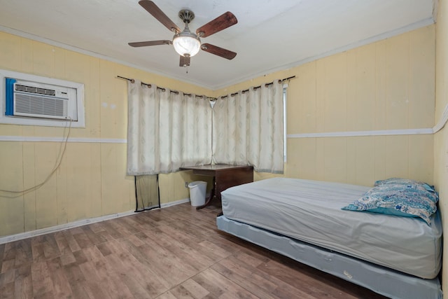 1005 Revere Dr, Pensacola, FL 32506 - bedroom featuring a wall unit AC, ornamental molding, ceiling fan, and wood finished floors