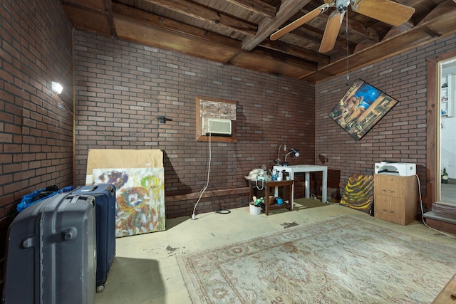 1005 Revere Dr, Pensacola, FL 32506 - misc room with unfinished concrete floors, a ceiling fan, and brick wall