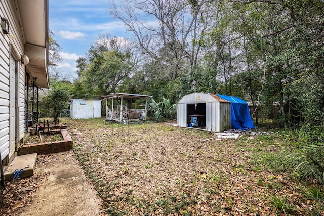 1005 Revere Dr, Pensacola, FL 32506 - view of yard featuring an outbuilding and a shed