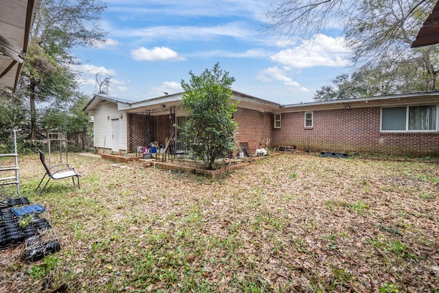 1005 Revere Dr, Pensacola, FL 32506 - back of house with brick siding and fence