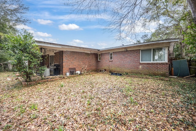 1005 Revere Dr, Pensacola, FL 32506 - back of house with central AC unit and brick siding