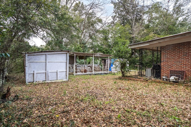 1005 Revere Dr, Pensacola, FL 32506 - view of yard with an outdoor structure