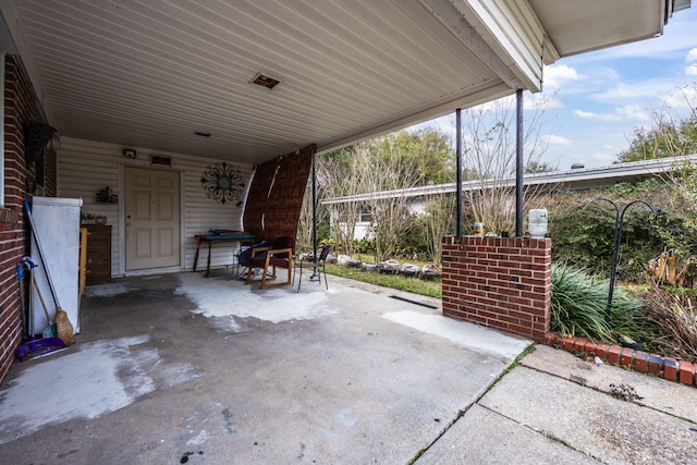1005 Revere Dr, Pensacola, FL 32506 - view of patio with an attached carport