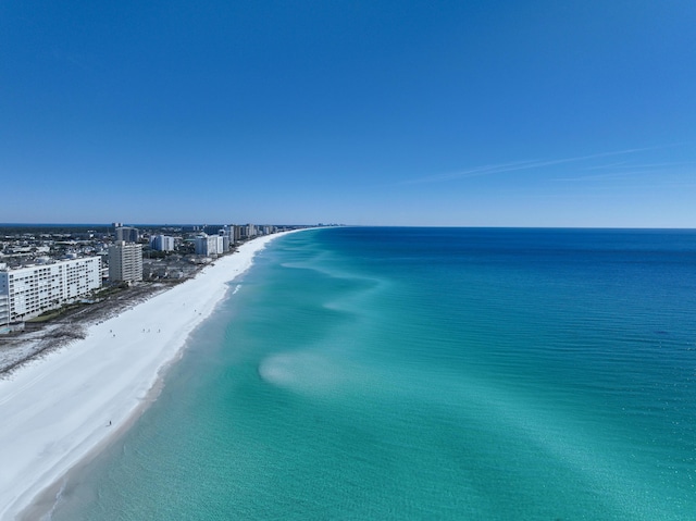 bird's eye view featuring a water view and a view of the beach