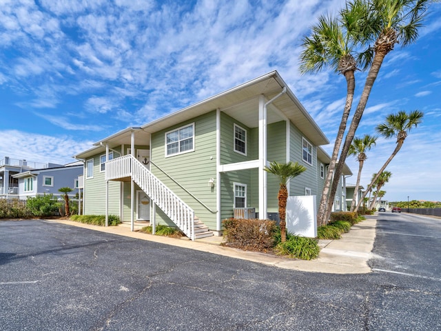 exterior space featuring stairway and a residential view