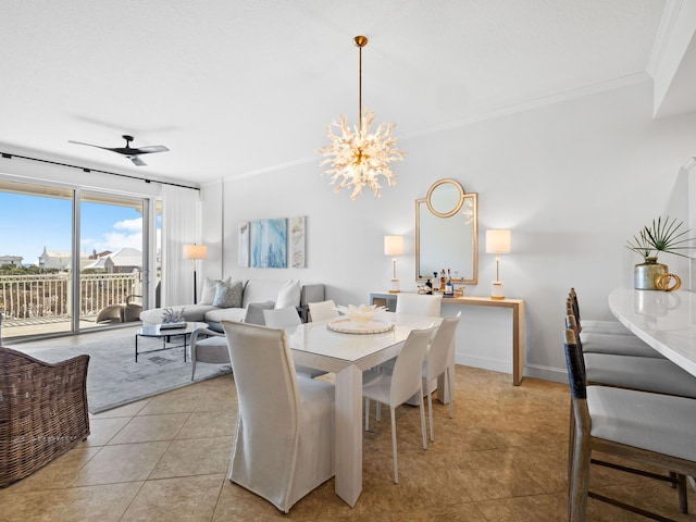 dining area featuring baseboards, ceiling fan with notable chandelier, crown molding, and light tile patterned flooring