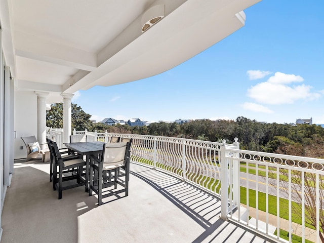 balcony with a patio area and outdoor dining space