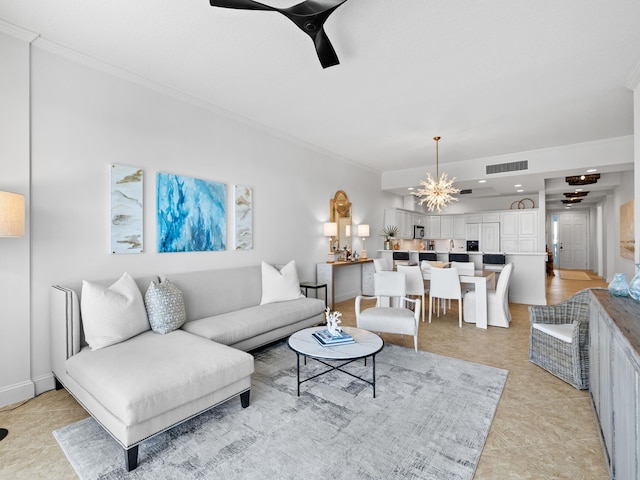 living room featuring visible vents, crown molding, and ceiling fan with notable chandelier