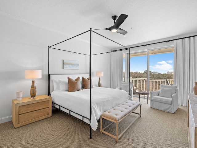 bedroom featuring ceiling fan, carpet floors, and access to exterior