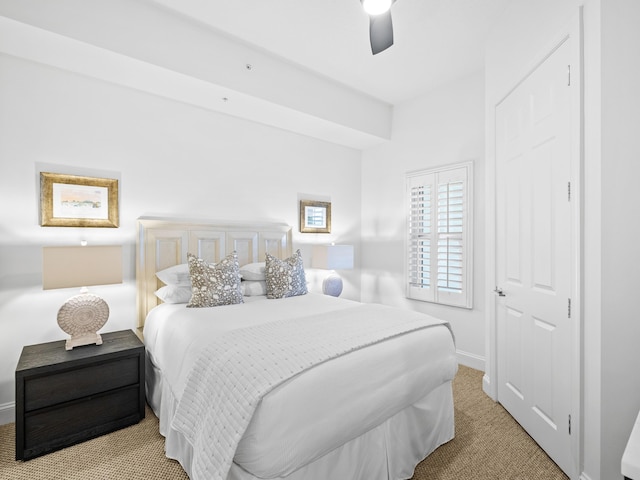 carpeted bedroom featuring ceiling fan and baseboards