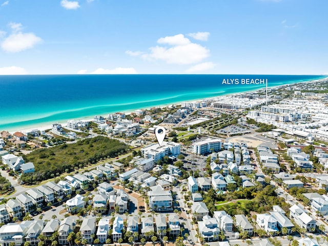 drone / aerial view with a residential view and a water view