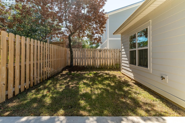 view of yard with a fenced backyard