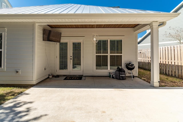 view of patio / terrace with french doors and fence