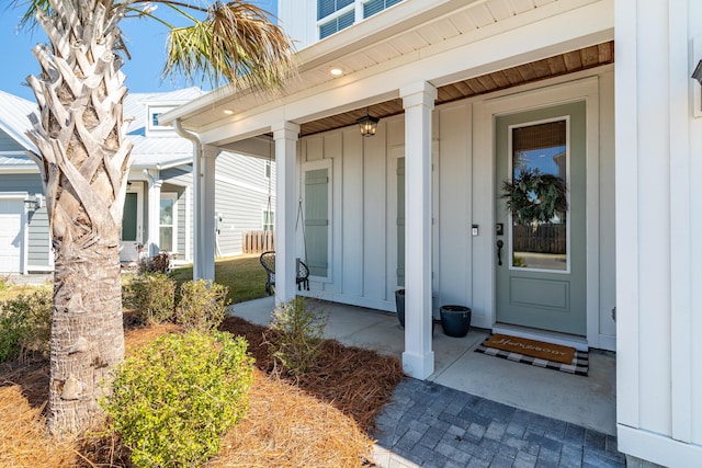 entrance to property featuring board and batten siding