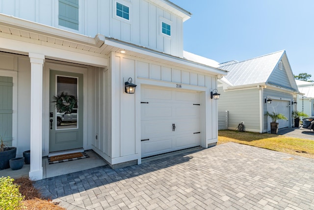 garage with decorative driveway