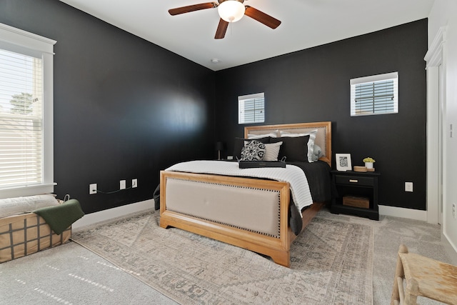 bedroom with a ceiling fan, carpet, and baseboards