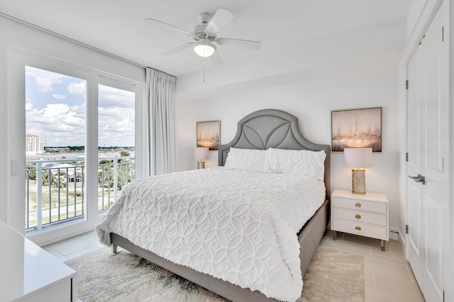 bedroom featuring light tile patterned floors, a closet, and a ceiling fan