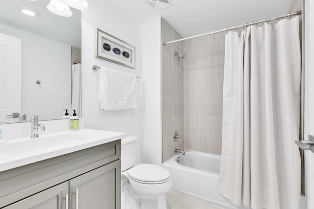 full bath featuring toilet, visible vents, shower / tub combo with curtain, and vanity