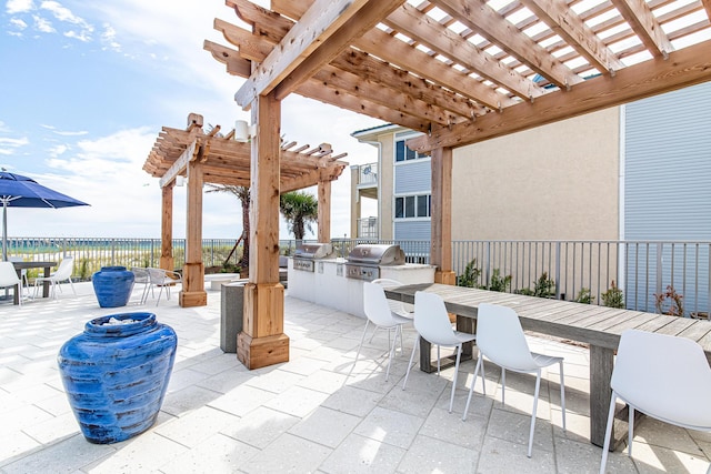 view of patio featuring a grill, a pergola, and area for grilling