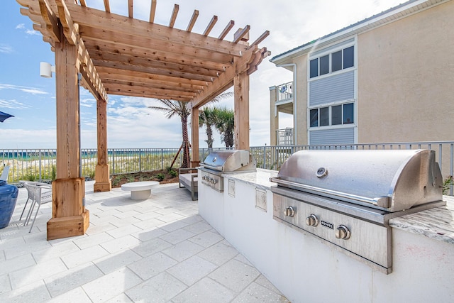 view of patio with fence, grilling area, a pergola, and area for grilling