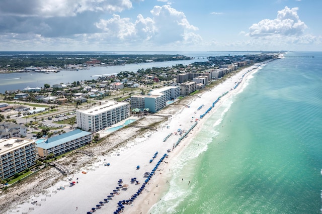 aerial view featuring a water view, a view of the beach, and a city view