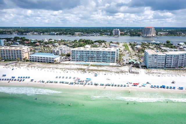 aerial view with a water view, a view of city, and a beach view