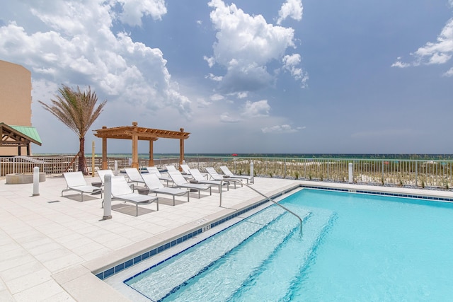 community pool featuring a patio area, fence, and a pergola