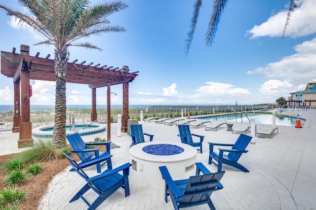 exterior space featuring a patio area, a hot tub, and a pergola