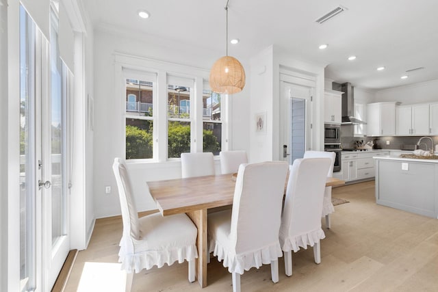 dining room featuring french doors, ornamental molding, visible vents, and recessed lighting