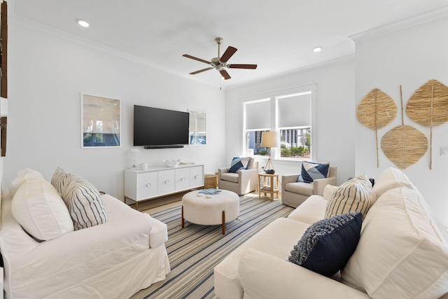 living room with ornamental molding, recessed lighting, and a ceiling fan