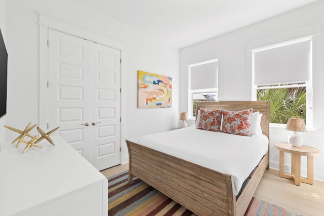 bedroom featuring light wood-style flooring