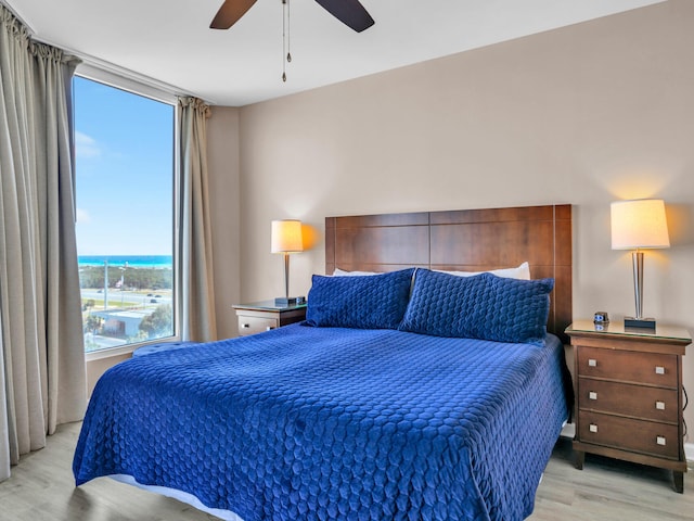 bedroom featuring light wood-type flooring and ceiling fan