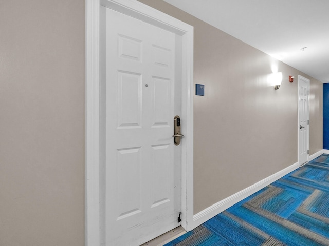 interior space featuring baseboards