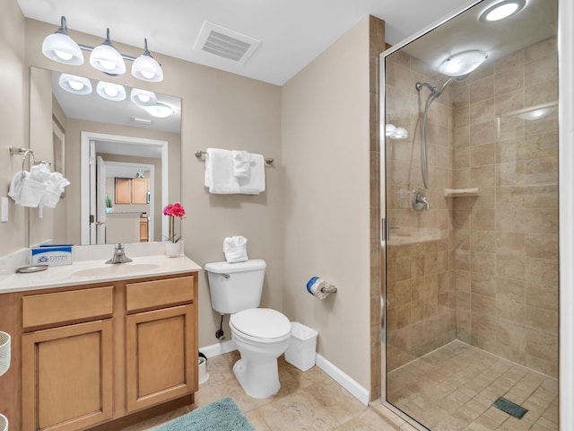 full bath featuring visible vents, toilet, a stall shower, baseboards, and vanity