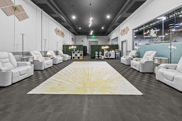 carpeted living area featuring recessed lighting and a high ceiling