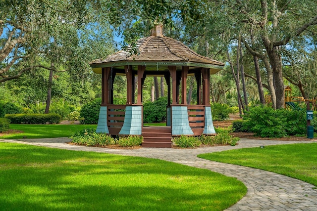 view of property's community featuring a yard and a gazebo