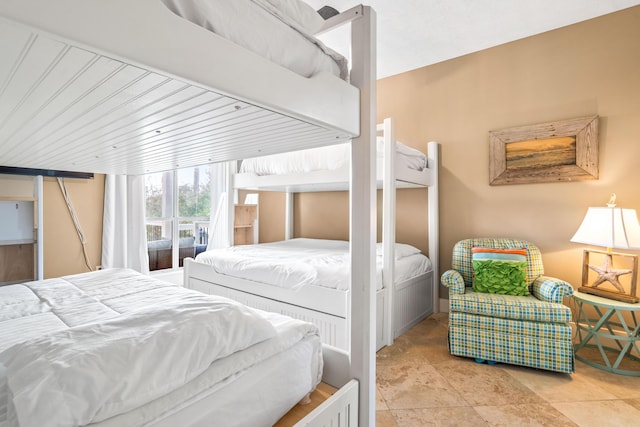 bedroom with tile patterned flooring and wood ceiling