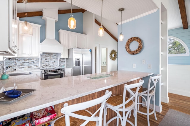 kitchen featuring appliances with stainless steel finishes, white cabinetry, a sink, light stone countertops, and premium range hood