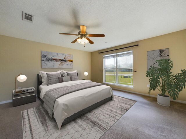 3098 Border Creek Dr, Crestview, FL 32539 - bedroom featuring a textured ceiling, baseboards, visible vents, and light colored carpet