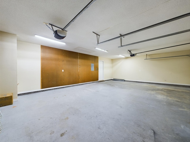 3098 Border Creek Dr, Crestview, FL 32539 - parking deck featuring baseboards and a garage door opener