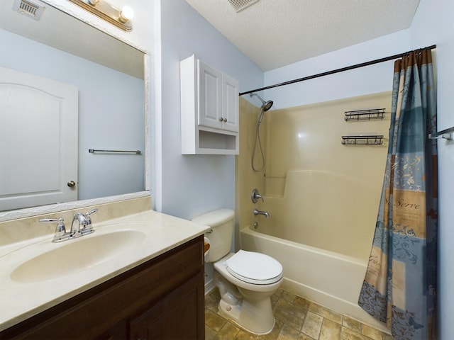 3098 Border Creek Dr, Crestview, FL 32539 - bathroom with a textured ceiling, toilet, vanity, visible vents, and shower / bath combo