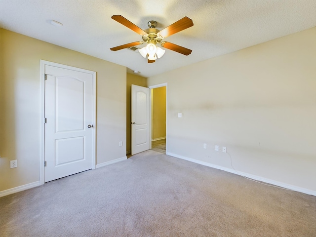 3098 Border Creek Dr, Crestview, FL 32539 - unfurnished bedroom featuring light carpet, baseboards, and a textured ceiling