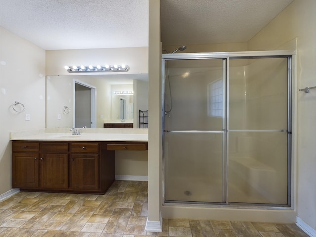 3098 Border Creek Dr, Crestview, FL 32539 - full bath featuring a stall shower, a textured ceiling, and vanity